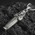 Load image into Gallery viewer, Sterling silver King Tut pendant necklace with an oxidized finish resting on textured volcanic rock, captured in a close-up premium studio composition.
