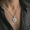 Load image into Gallery viewer, Polished silver compass pendant necklace worn on the neck, shown against the chest in a clean and elegant everyday wear composition.

