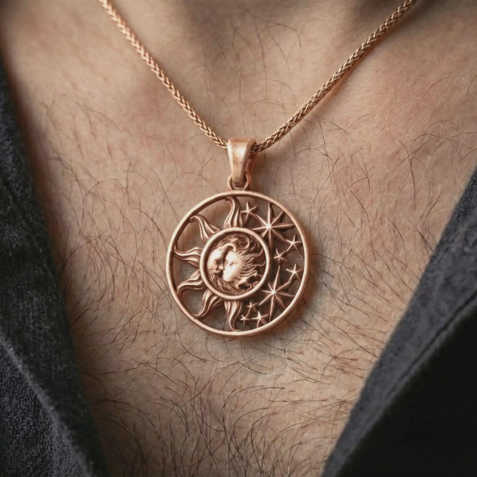 Rose gold plated sun and moon pendant necklace worn on the neck, presented in a close-up lifestyle shot with a refined masculine aesthetic.