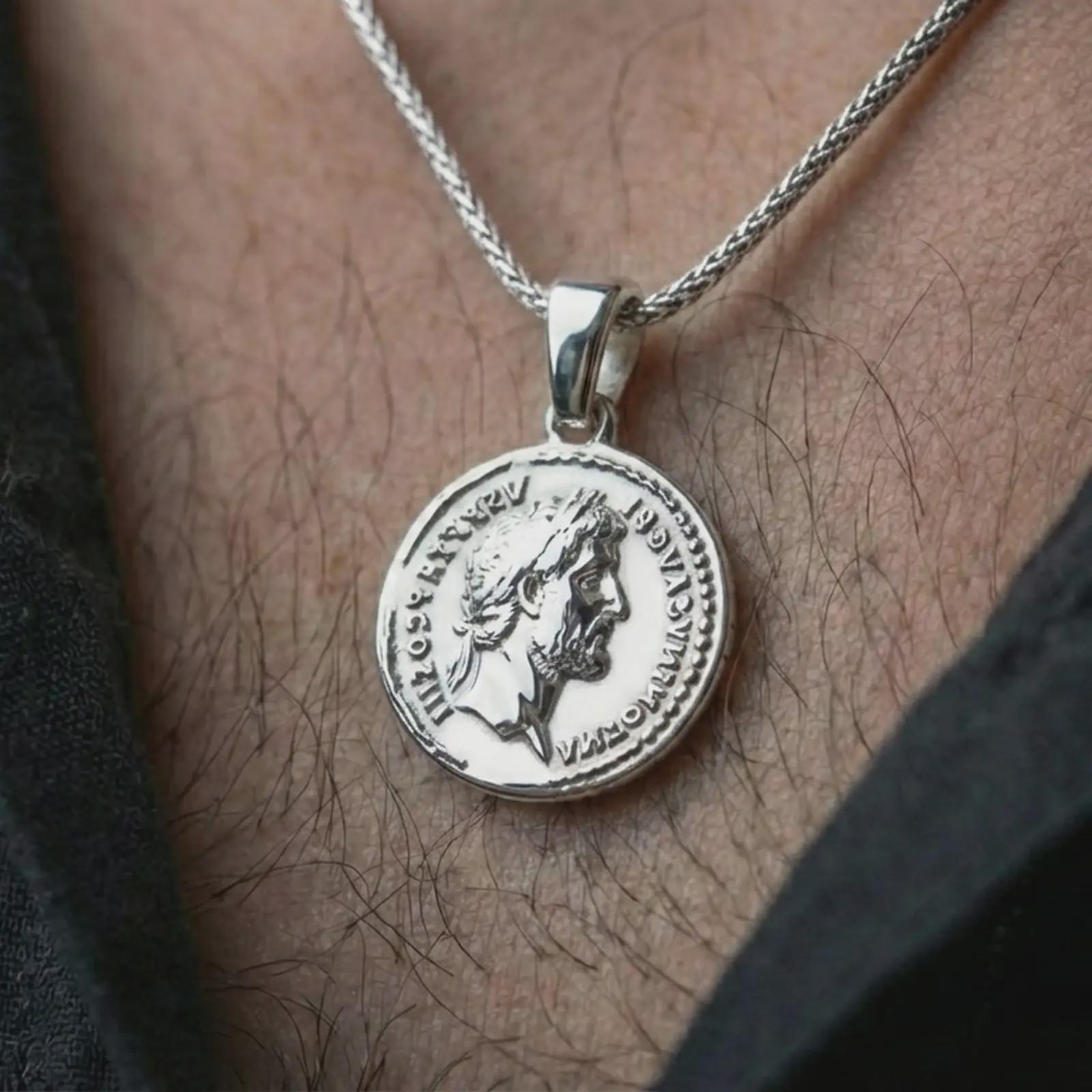 Polished silver Roman coin pendant necklace worn on the neck, shown in a clean model shot with the classical emperor medallion centered for a refined antiquity-inspired look.
