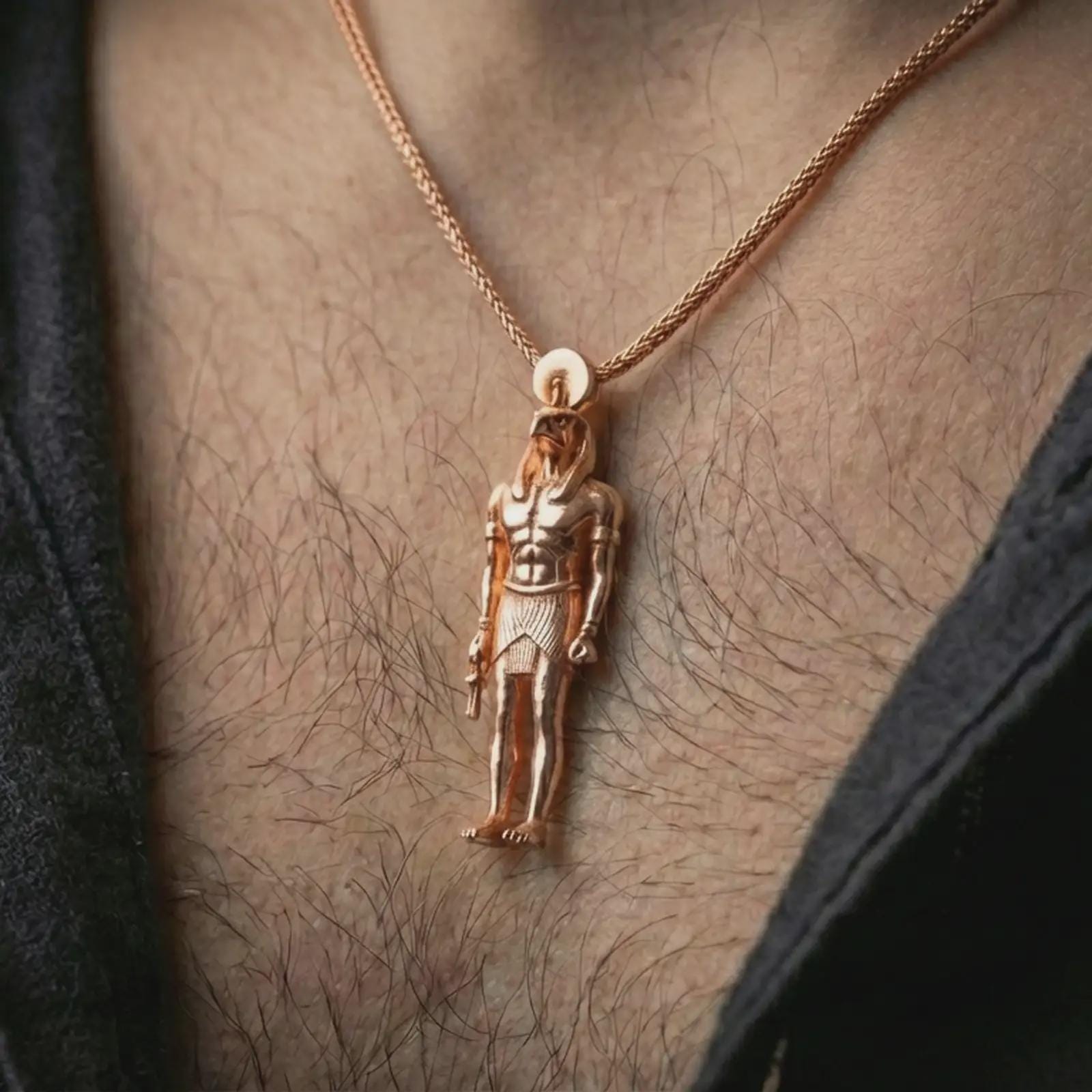 Rose gold plated Ra amulet pendant necklace worn on the neck, presented in an elegant model photograph with a timeless Egyptian and collector-inspired aesthetic.
