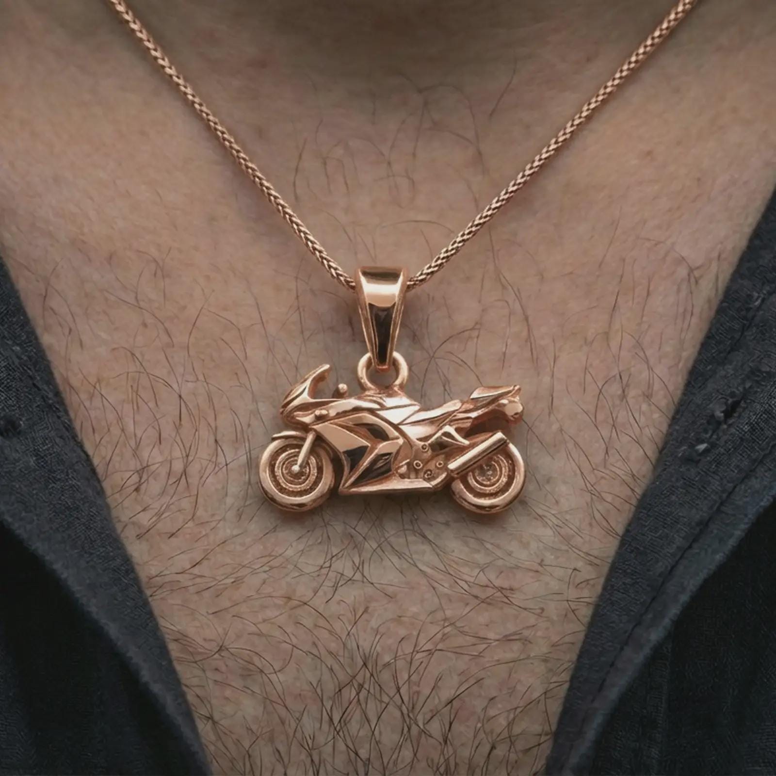 Rose gold plated sportbike motorcycle pendant necklace worn on the neck, presented in a close-up lifestyle shot with a refined masculine aesthetic.