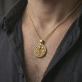 Load image into Gallery viewer, Gold plated Art Nouveau woman pendant necklace worn on the neck, captured on a human model in a premium dark-toned lifestyle frame.
