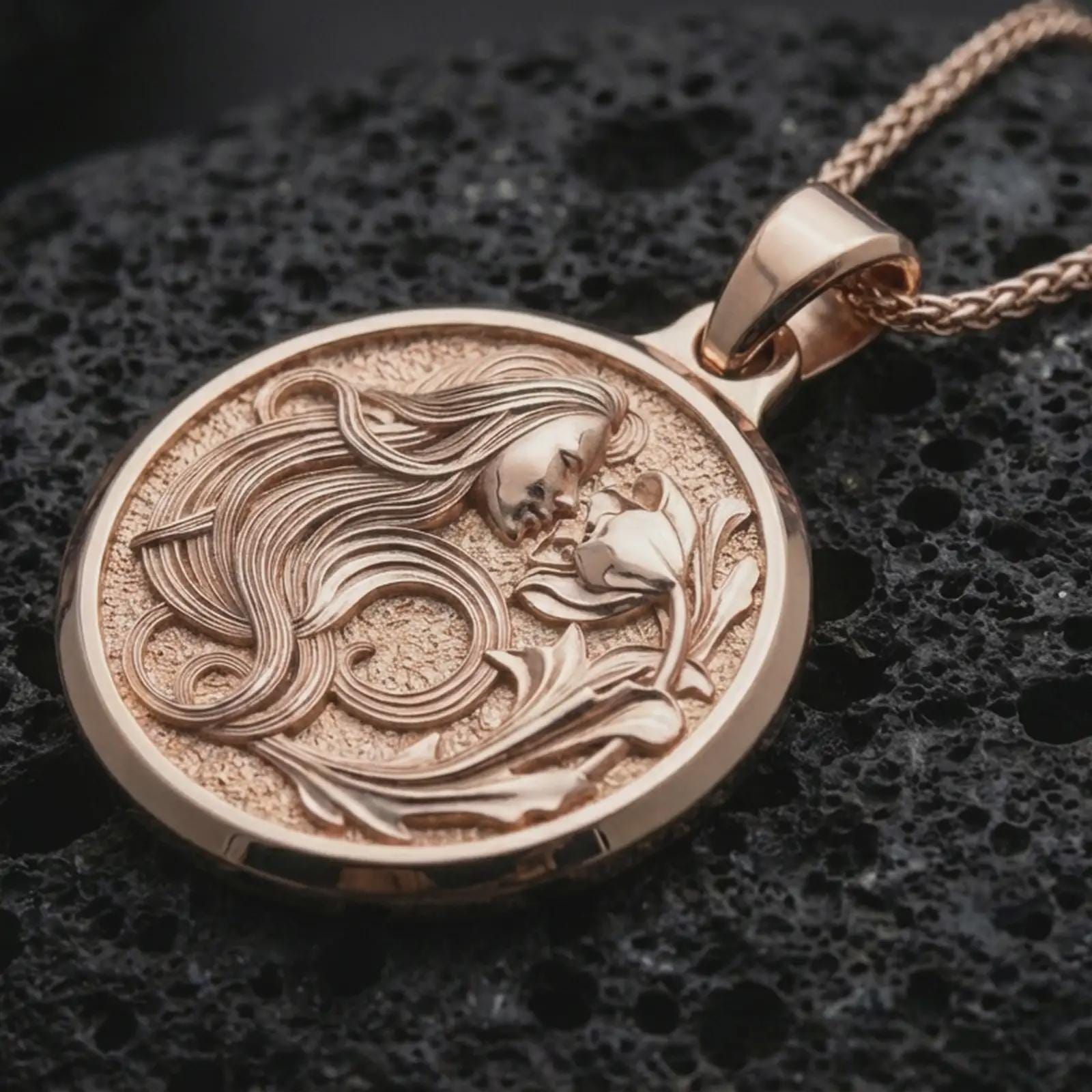 Rose gold plated Art Nouveau woman pendant necklace on dark volcanic rock, photographed in a detailed premium studio macro view.