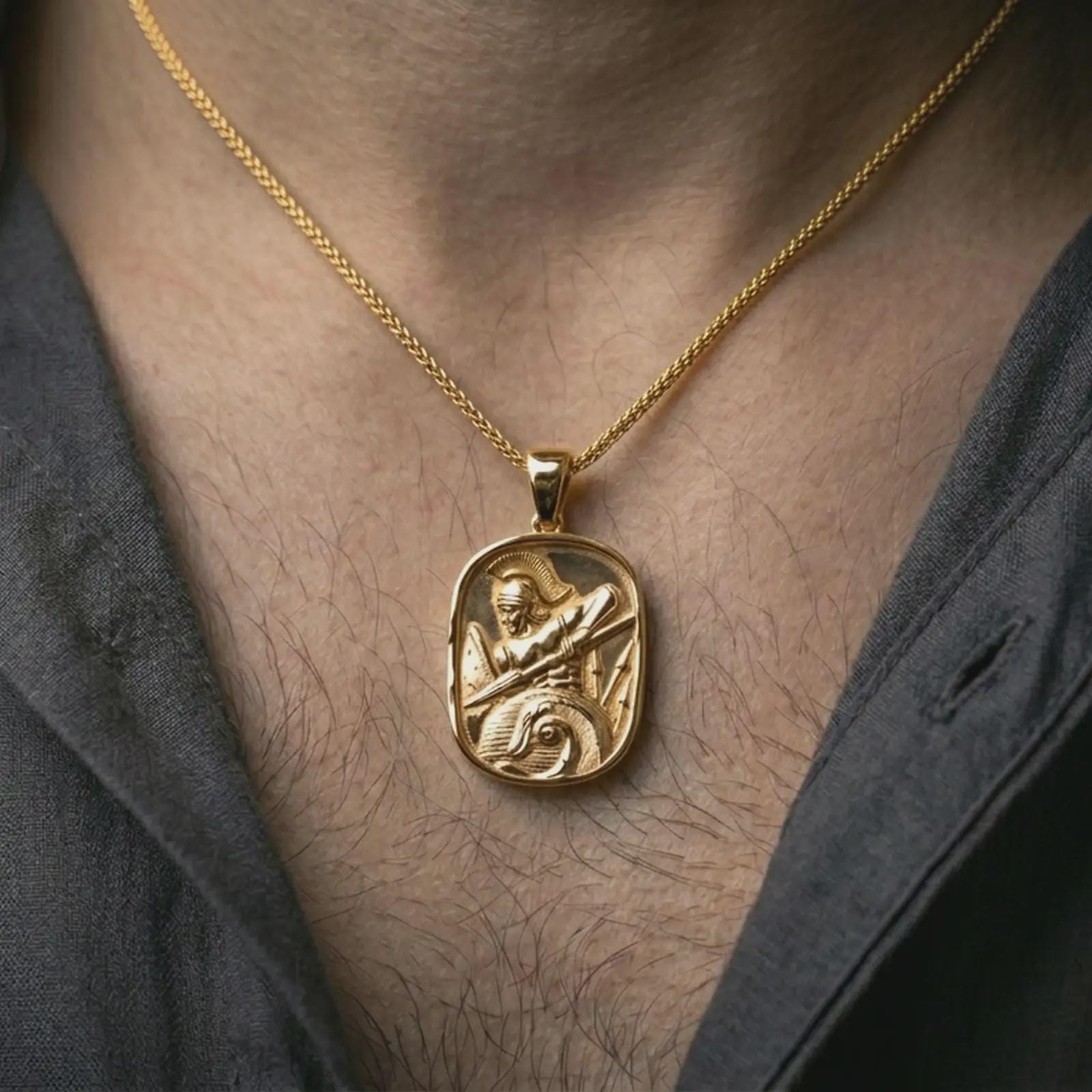 Gold plated Roman soldier pendant necklace worn on the neck, captured on a human model in a premium dark-toned lifestyle frame.