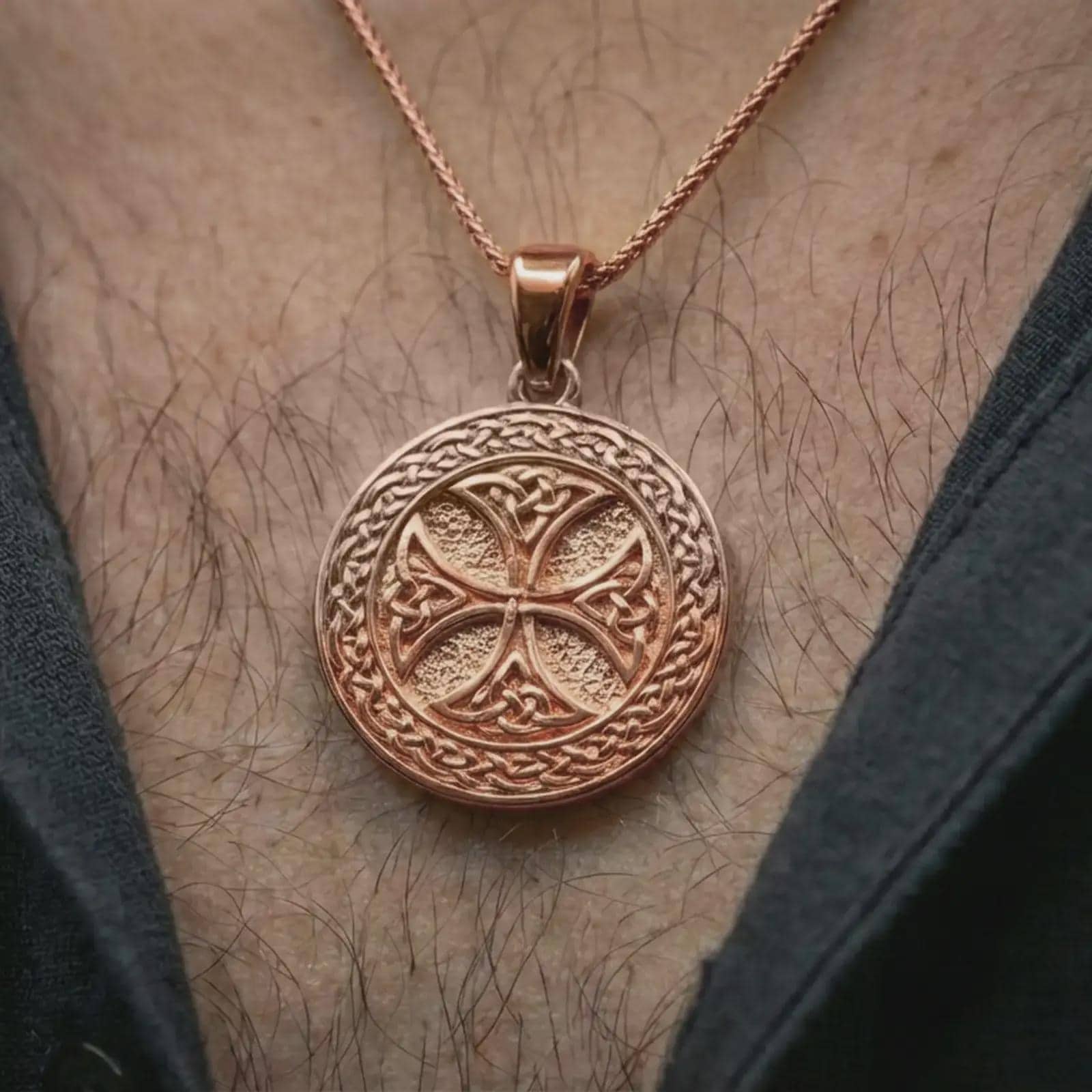 Rose gold plated Celtic knot medallion necklace worn on the neck, presented in a close-up lifestyle shot with a refined masculine aesthetic.