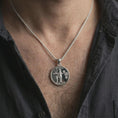 Load image into Gallery viewer, Polished silver Venus Amor pendant necklace worn on the neck, shown against the chest in a clean and elegant everyday wear composition.
