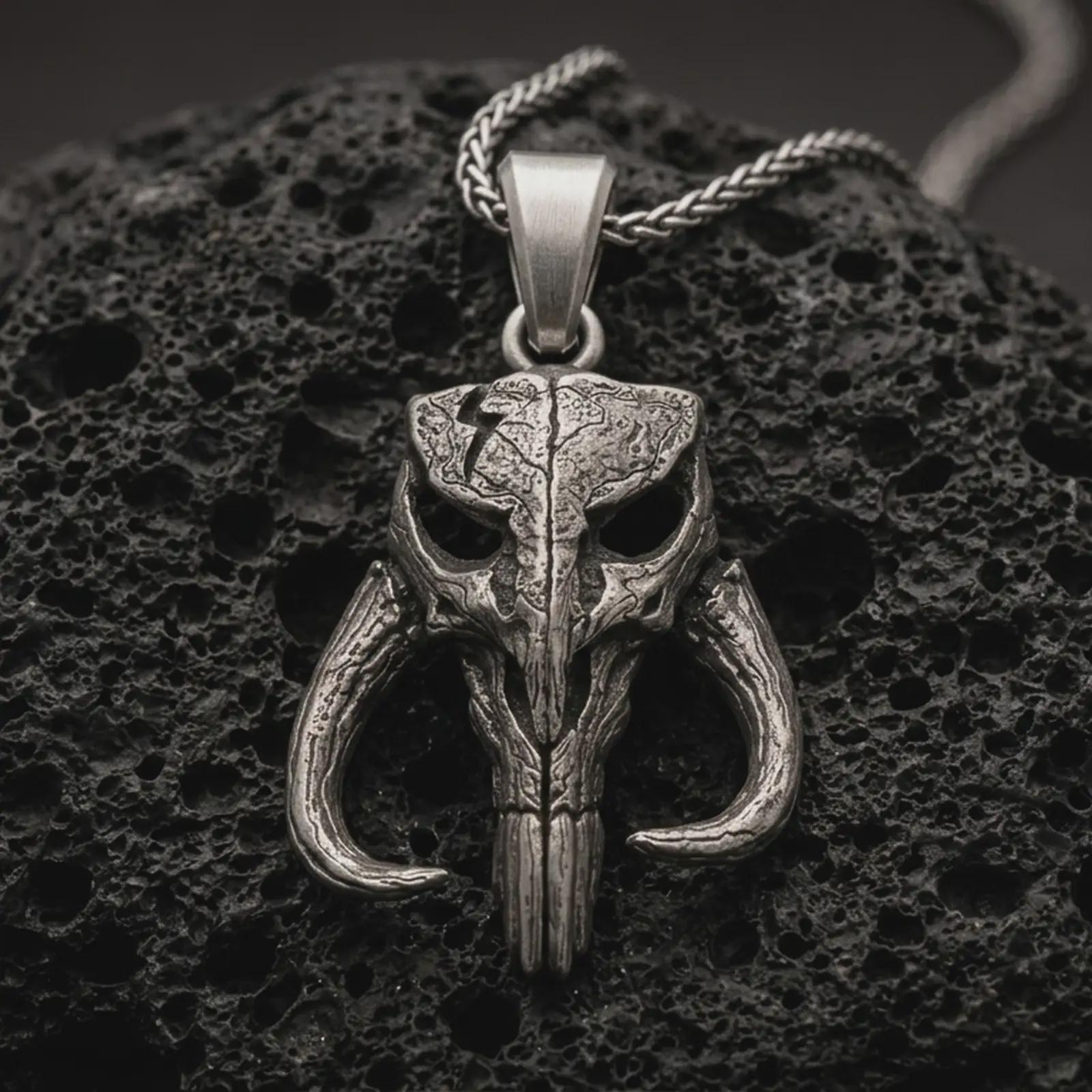 Sterling silver Mythosaur skull pendant necklace with an oxidized finish resting on textured volcanic rock, captured in a close-up premium studio composition.