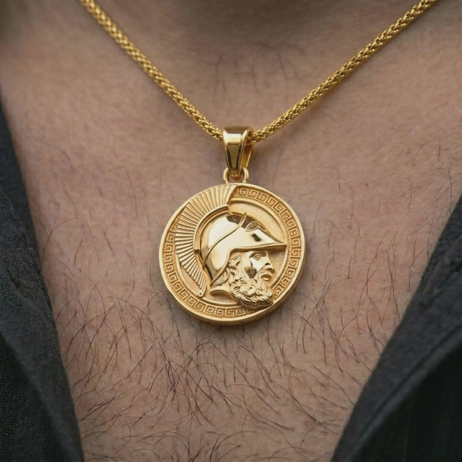 Gold plated Spartan helmet pendant necklace worn on the neck, captured on a human model in a premium dark-toned lifestyle frame.