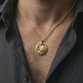 Load image into Gallery viewer, Gold plated Spartan warrior pendant necklace worn on the neck, captured on a human model in a premium dark-toned lifestyle frame.
