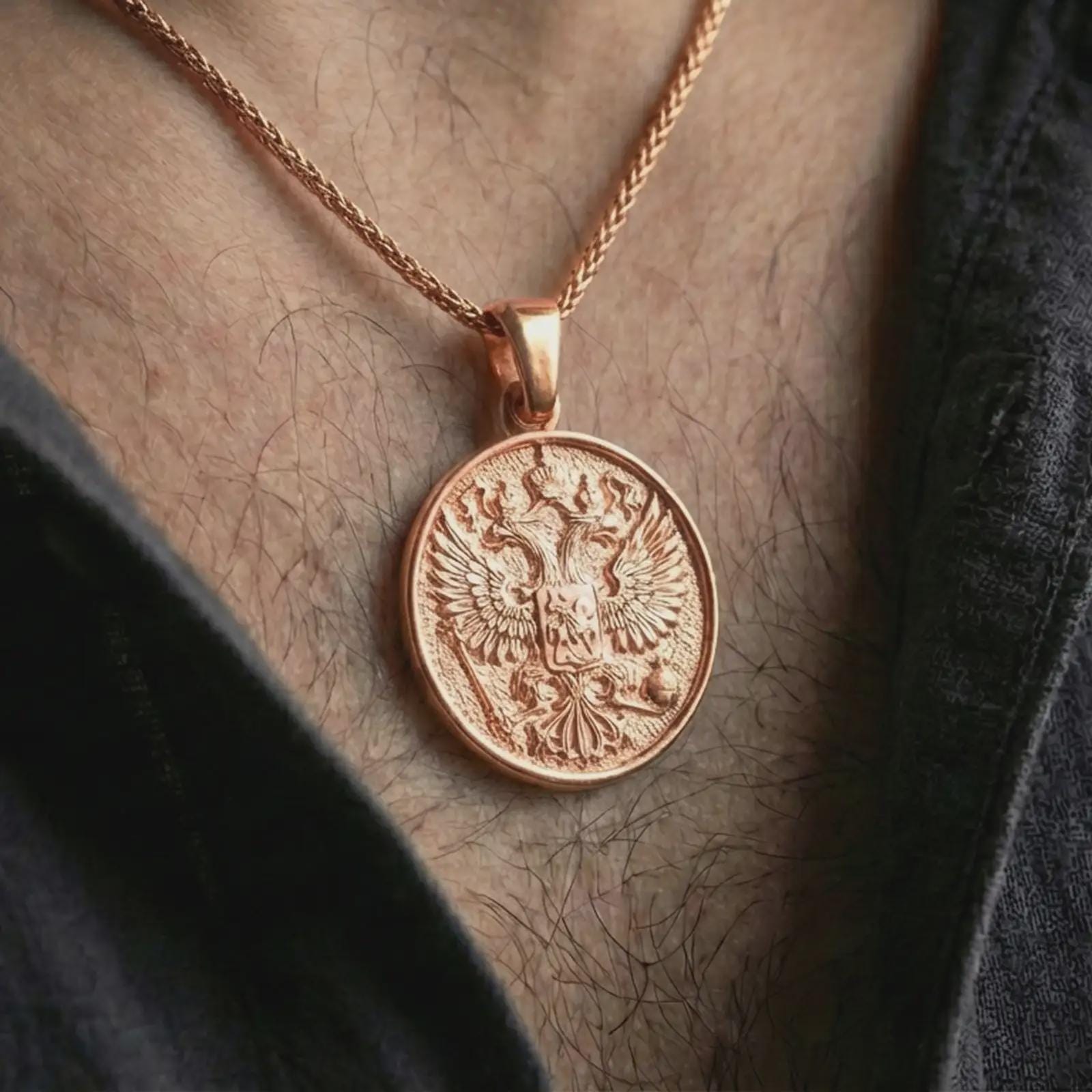 Rose gold plated double headed eagle pendant necklace worn on the neck, presented in an elegant model photograph with a timeless royal and collector-inspired aesthetic.
