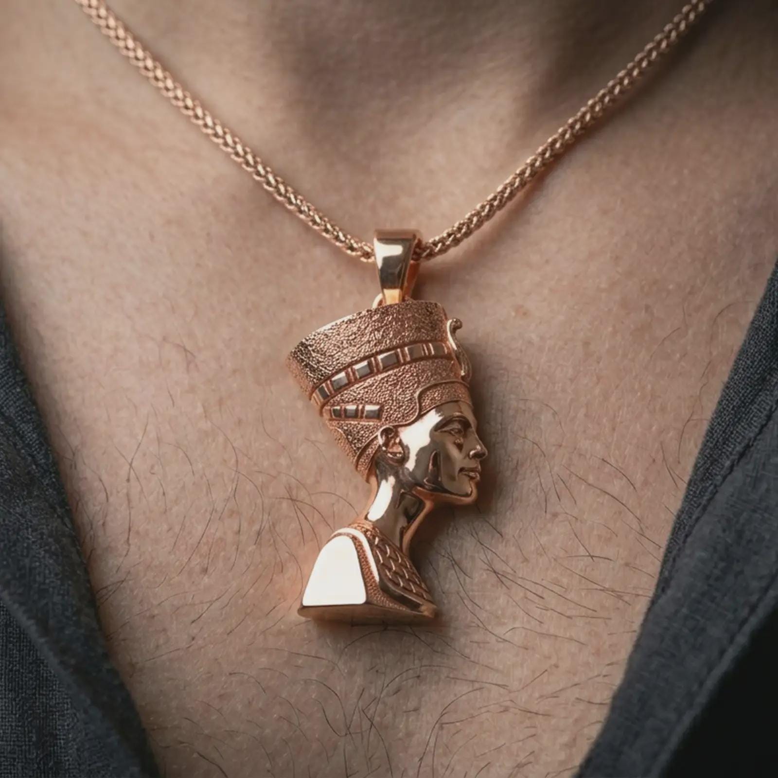 Rose gold plated Nefertiti pendant necklace worn on the neck, presented in a close-up lifestyle shot with a refined regal aesthetic.