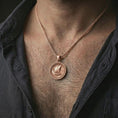 Load image into Gallery viewer, Rose gold plated Viking ship pendant necklace worn on the neck, presented in a close-up lifestyle shot with a refined Nordic aesthetic.
