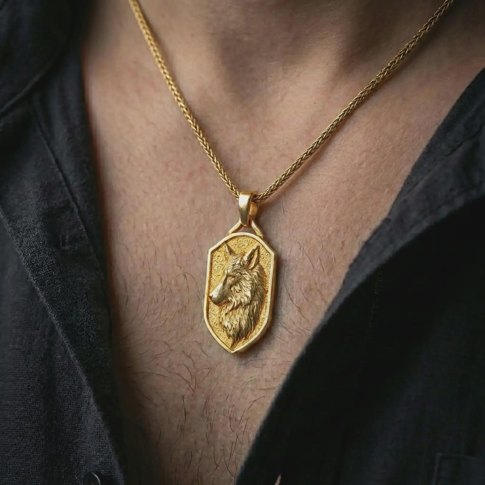 Gold plated wolf shield pendant necklace worn on the neck, captured on a human model in a premium dark-toned lifestyle frame.