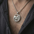 Load image into Gallery viewer, Polished silver lion and bear family pendant necklace worn on the neck, shown against the chest in a clean and elegant everyday wear composition.
