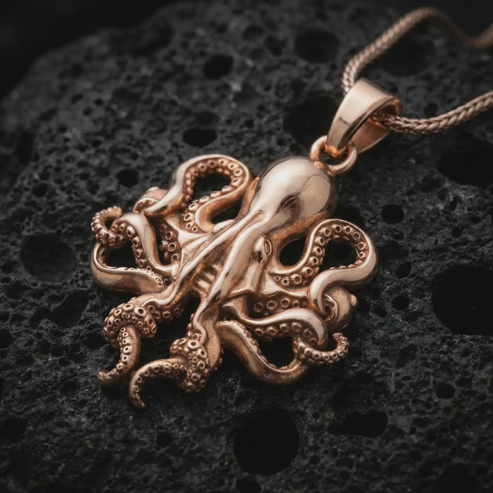 Rose gold plated octopus pendant necklace on dark volcanic rock, photographed in a detailed premium studio macro view.