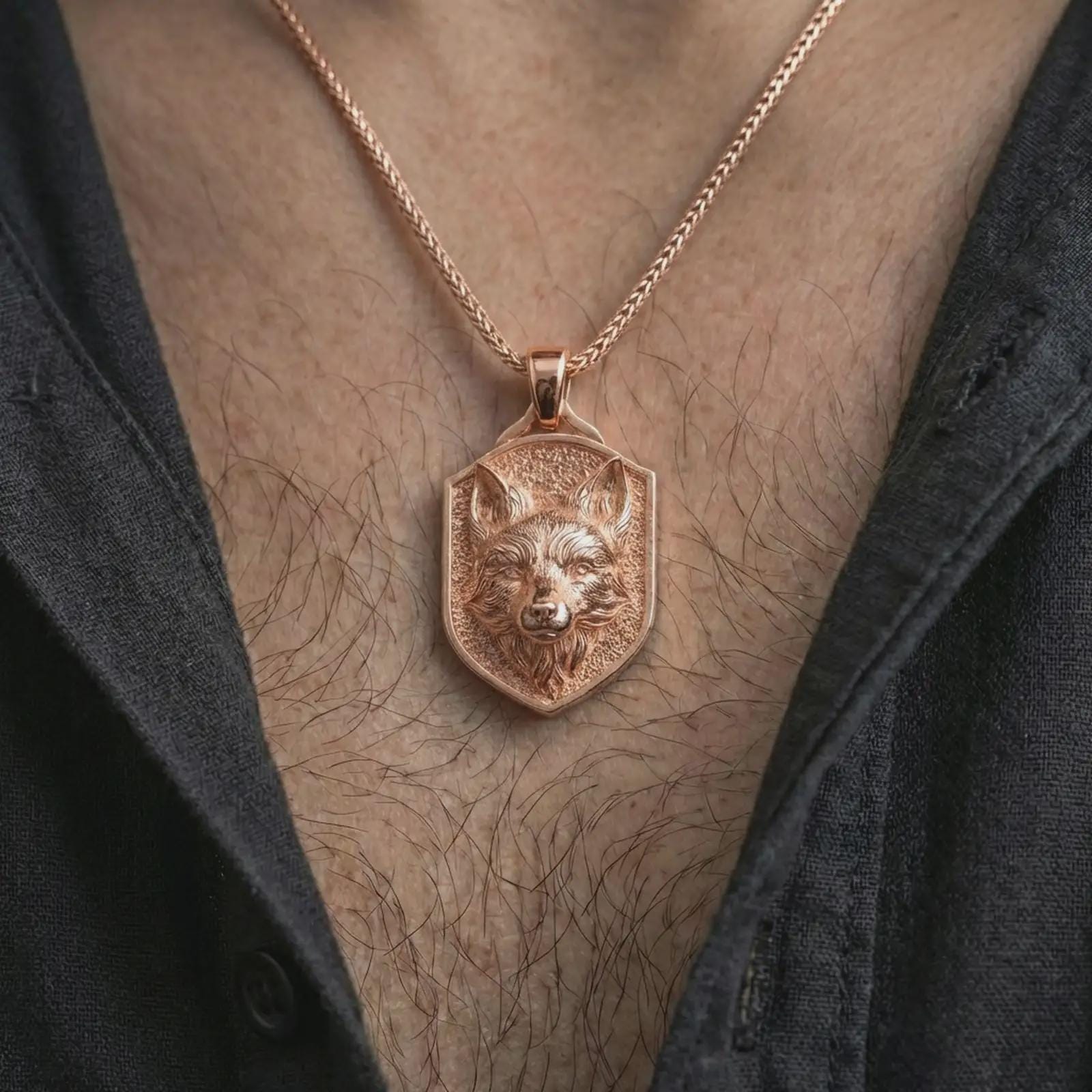 Rose gold plated fox shield pendant necklace worn on the neck, presented in a close-up lifestyle shot with a refined wildlife-inspired aesthetic.