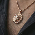 Load image into Gallery viewer, Rose gold plated lioness pendant necklace worn on the neck, presented in a close-up lifestyle shot with a refined wildlife-inspired aesthetic.
