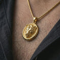 Load image into Gallery viewer, Gold plated lioness pendant necklace worn on the neck, captured on a human model in a premium dark-toned lifestyle frame.
