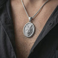 Load image into Gallery viewer, Polished silver fox medallion pendant necklace worn on the neck, shown against the chest in a clean and striking everyday wear composition.
