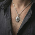 Load image into Gallery viewer, Polished silver lion head pendant necklace worn on the neck, shown against the chest in a clean and striking everyday wear composition.
