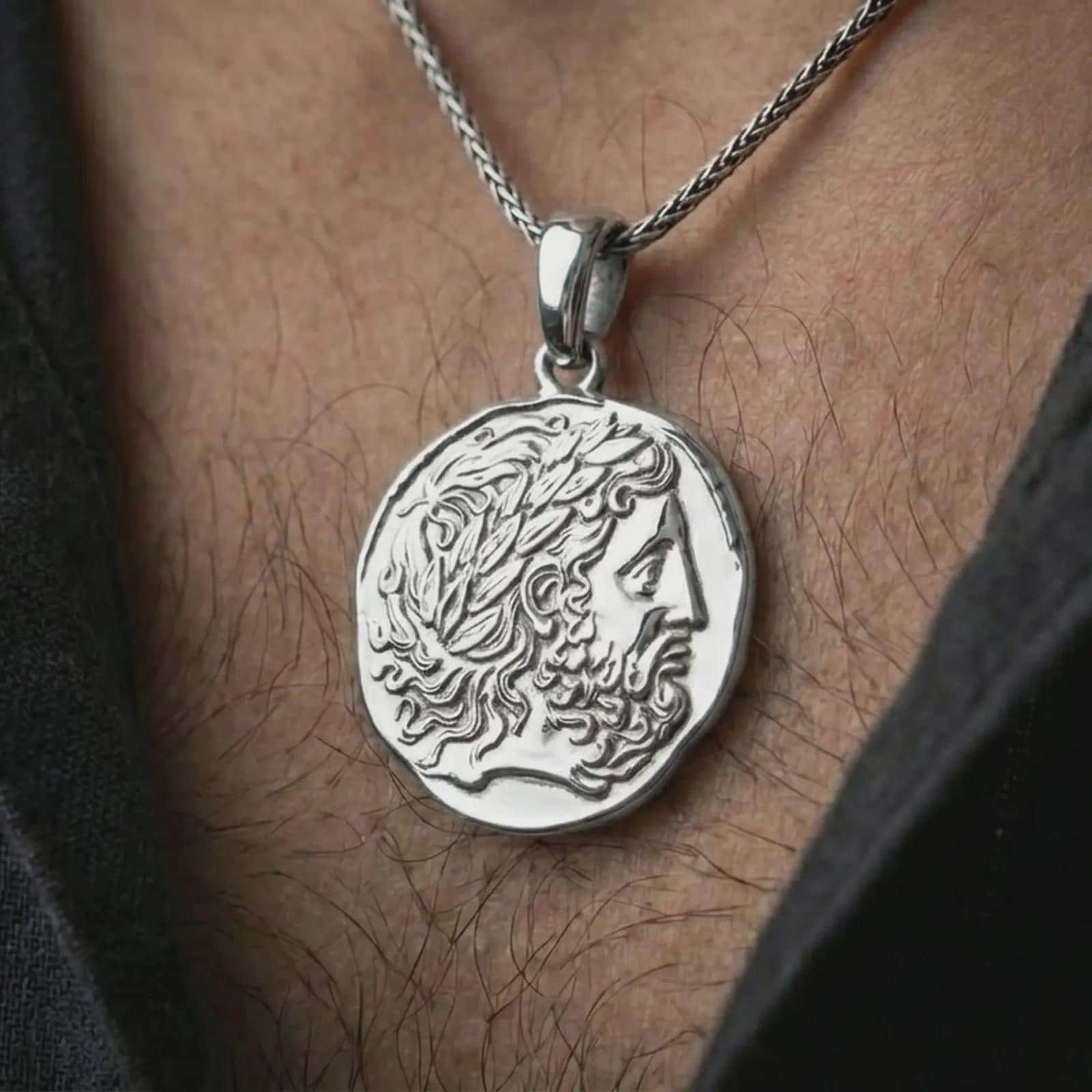 Polished silver ancient Greek coin pendant necklace worn on the neck, shown in a clean model shot with the antique-inspired medallion centered for a refined antiquity look.