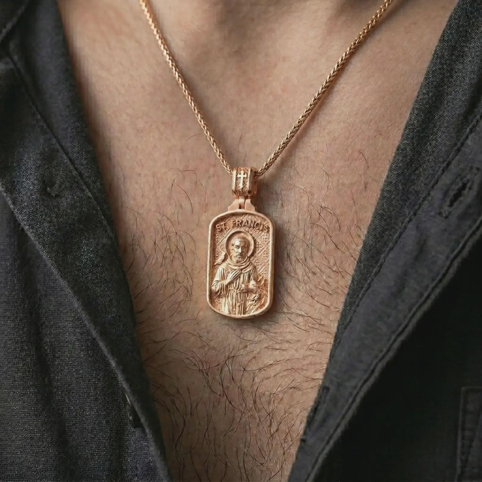 Rose gold plated Saint Francis pendant necklace worn on the chest, close-up lifestyle shot featuring the sacred Saint Francis design with warm rose gold tones.