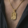 Load image into Gallery viewer, Gold plated Saint James the Apostle pendant necklace worn on the chest, premium lifestyle jewelry photo with the Saint James medal centered on a spiga chain.
