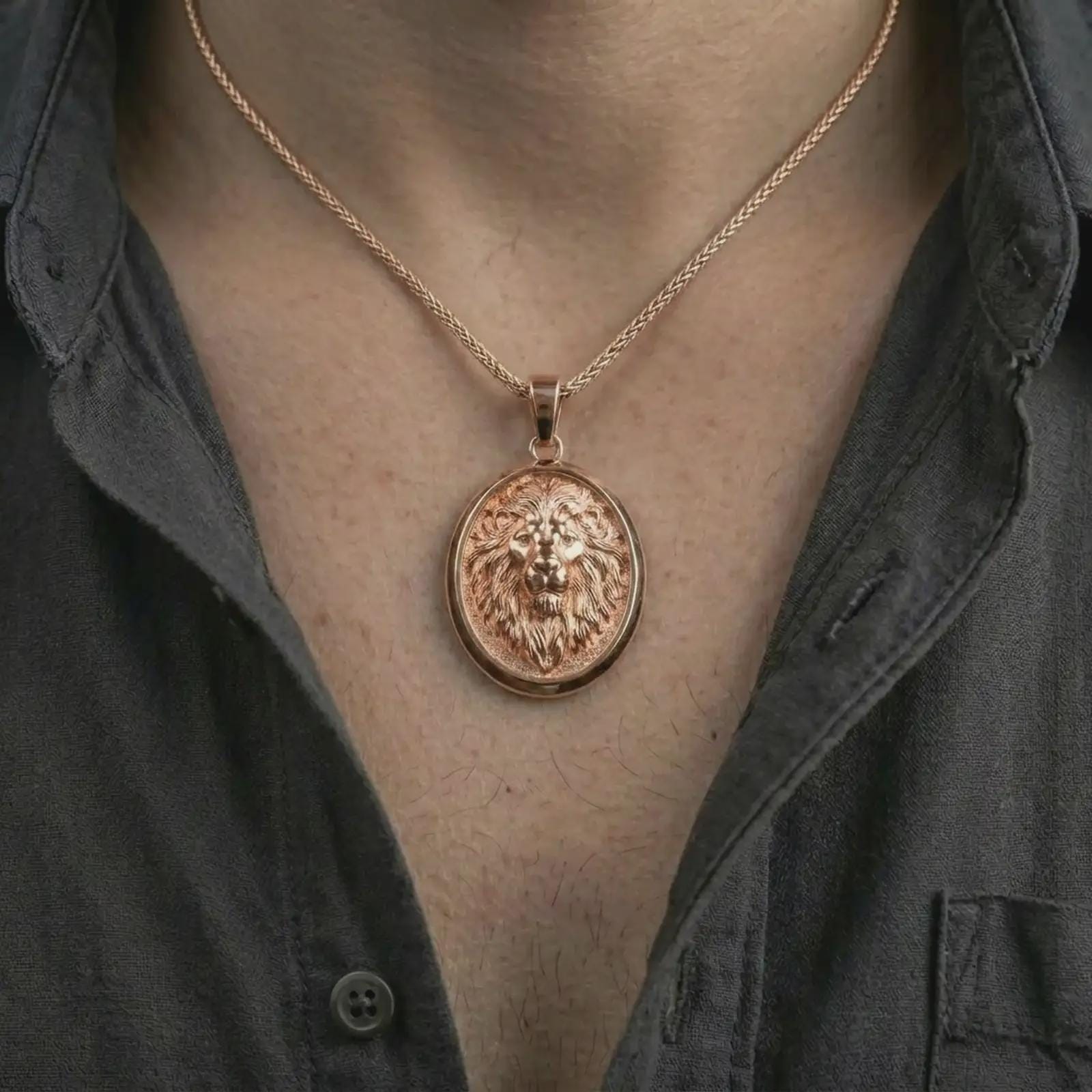 Rose gold plated lion medallion pendant necklace worn on the neck, presented in a close-up lifestyle shot with a refined wildlife-inspired aesthetic.
