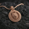 Load image into Gallery viewer, Rose gold plated Fenrir wolf pendant necklace on dark volcanic rock, photographed in a detailed premium studio macro view.
