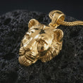 Load image into Gallery viewer, Gold plated 3D lioness pendant necklace presented on porous volcanic rock, highlighting the fierce animal charm in a luxurious close-up jewelry image.
