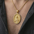 Load image into Gallery viewer, Gold plated Saint Jude pendant necklace worn on the chest, premium lifestyle jewelry photo with the Saint Jude medal centered on a spiga chain.
