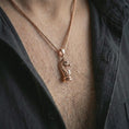 Load image into Gallery viewer, Rose gold plated knight chess piece pendant necklace worn on the neck, presented in a close-up lifestyle shot with a refined strategy-inspired aesthetic.
