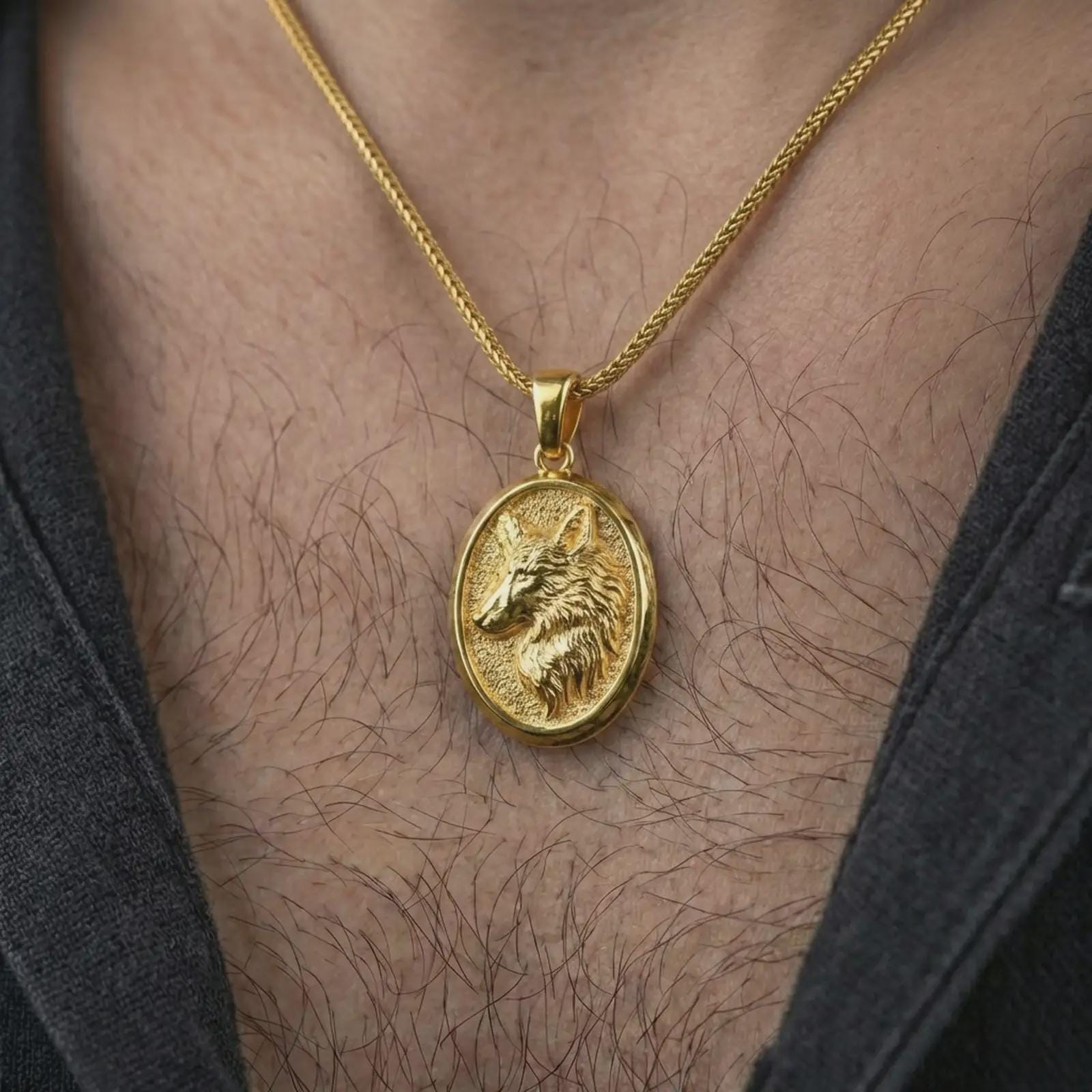 Gold plated wolf medallion pendant necklace worn on the neck, captured on a human model in a premium dark-toned lifestyle frame.