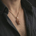 Load image into Gallery viewer, Rose gold plated gorilla head pendant necklace worn on the neck, presented in a close-up lifestyle shot with a refined streetwear-inspired aesthetic.
