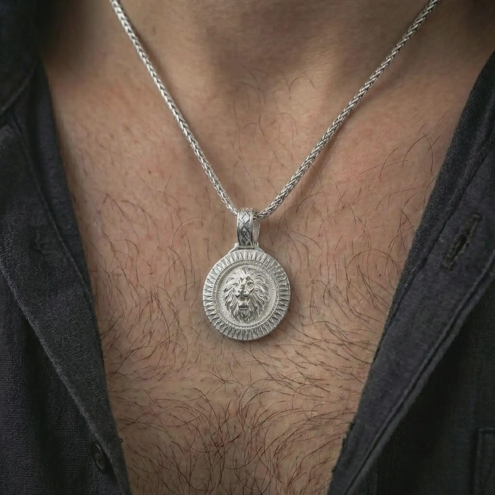 Polished silver Viking lion medallion pendant necklace worn on the neck, shown against the chest in a clean and striking everyday wear composition.