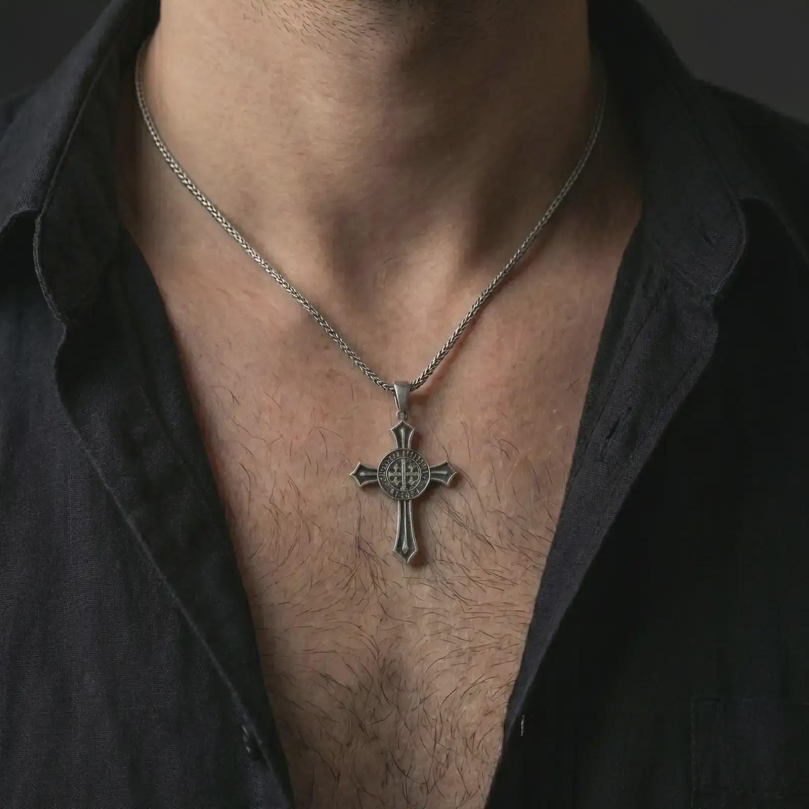 Oxidized Knights Templar cross pendant necklace worn on the neck, styled in a dark lifestyle image that highlights the medieval crusader symbol against the chest.