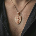 Load image into Gallery viewer, Rose gold plated Saint Michael pendant necklace worn on the neck, presented in an elegant model photograph with a strong spiritual and protective jewelry aesthetic.
