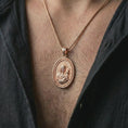 Load image into Gallery viewer, Rose gold plated Madonna and Child pendant necklace worn on the neck, presented in a premium model photograph with a soft devotional aesthetic and classic Catholic jewelry presence.
