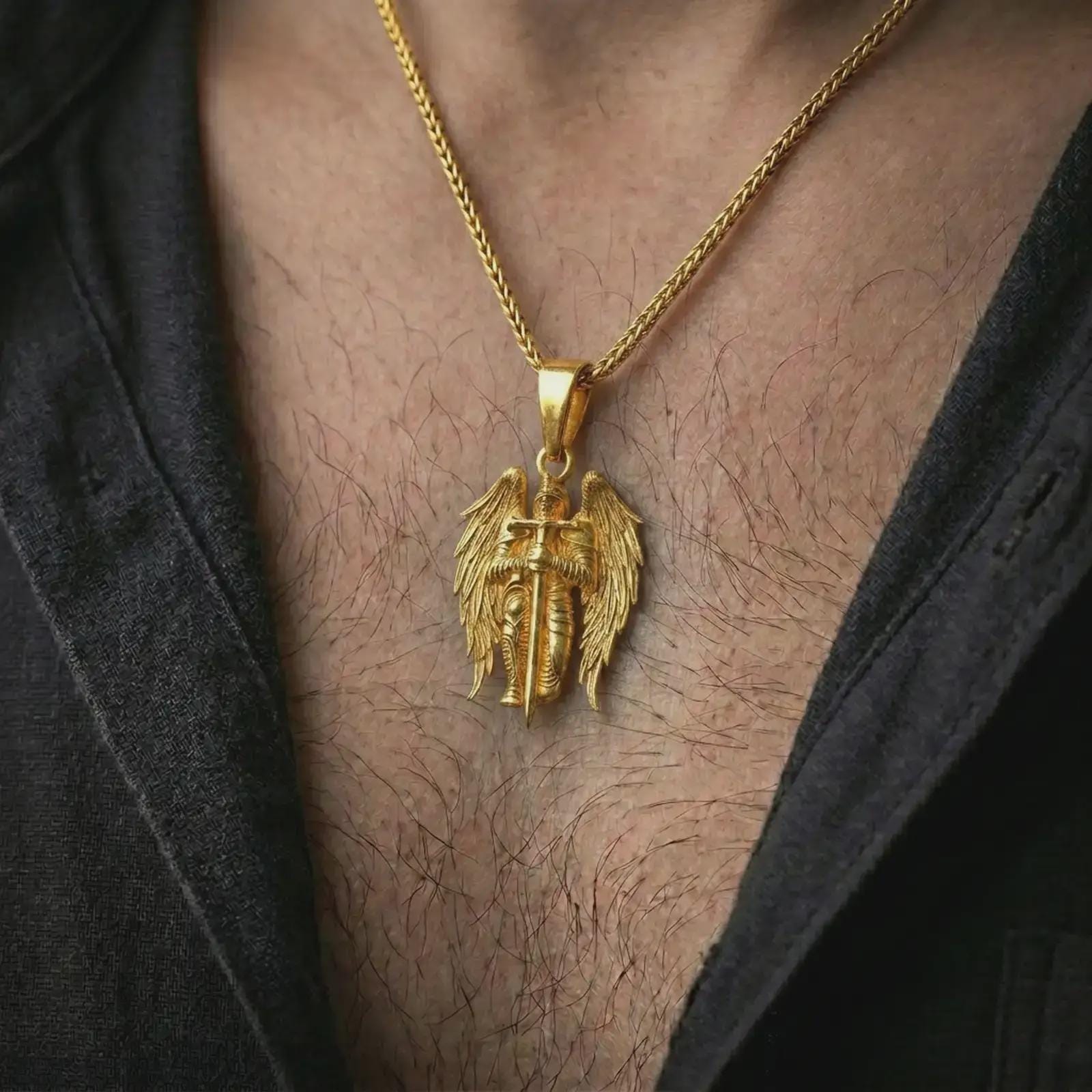 Gold plated angel warrior pendant necklace worn on the neck, captured in an elegant lifestyle composition that highlights the celestial warrior motif as a meaningful Christian statement piece.