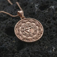 Load image into Gallery viewer, Rose gold plated Manipura chakra pendant necklace on textured volcanic rock, detailed macro product shot with soft warm reflections and spiritual mandala symbolism.
