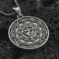 Load image into Gallery viewer, Oxidized Manipura chakra pendant necklace on textured volcanic rock, close-up studio shot highlighting the solar plexus symbol, lotus petals, geometric center, and antique silver contrast.
