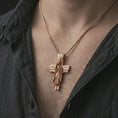 Load image into Gallery viewer, Rose gold plated Jesus cross pendant necklace worn on the chest, close-up lifestyle shot featuring the sacred Jesus cross design with warm rose gold tones.

