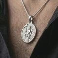 Load image into Gallery viewer, Polished silver Achaemenid soldier pendant necklace worn on the neck, shown against the chest in a clean close-up model image with a refined heritage-inspired and masculine appearance.
