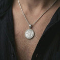 Load image into Gallery viewer, Polished silver Pope Innocent coin pendant necklace worn on the neck, shown in a clean model shot with the round papal portrait pendant centered for a refined heritage-inspired look.
