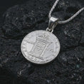 Load image into Gallery viewer, Polished silver Pope Innocent coin pendant necklace displayed on dark volcanic rock, shown in a premium close-up image that highlights the crowned papal bust and historical medal engraving.
