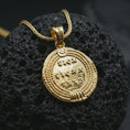 Load image into Gallery viewer, Gold plated Emperor Constans coin pendant necklace photographed on porous black volcanic stone, emphasizing the imperial side-profile bust and engraved Latin lettering in a luxury historical jewelry composition.
