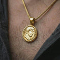 Load image into Gallery viewer, Gold plated Emperor Constans coin pendant necklace worn on the neck, captured in a premium lifestyle composition that highlights the antique imperial coin motif as a distinctive heritage jewelry accent.
