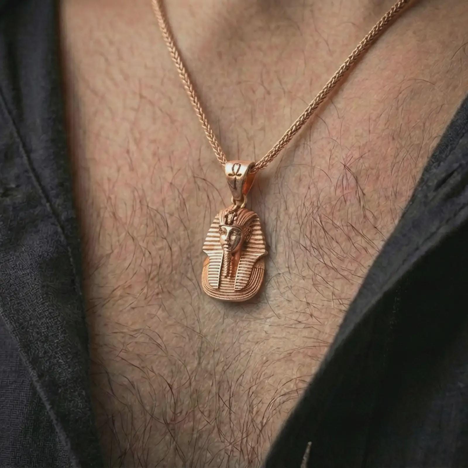 Rose gold plated Tutankhamun pharaoh pendant necklace worn on the neck, presented in an elegant model photograph with a timeless Egyptian and collector-inspired aesthetic.