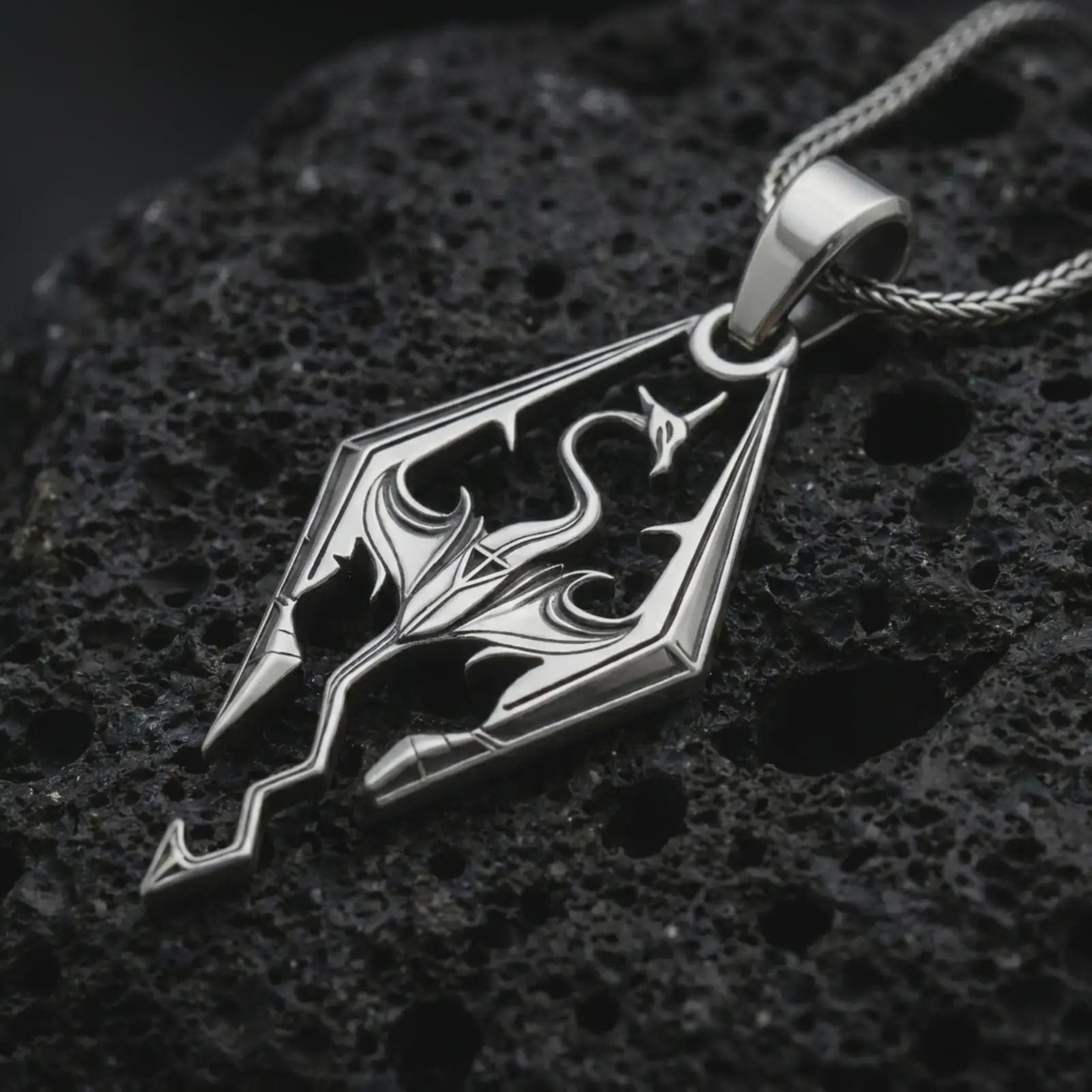 Polished silver Skyrim dragon pendant necklace on textured volcanic rock, centered macro jewelry photo with sharp fantasy emblem details and bright silver highlights.